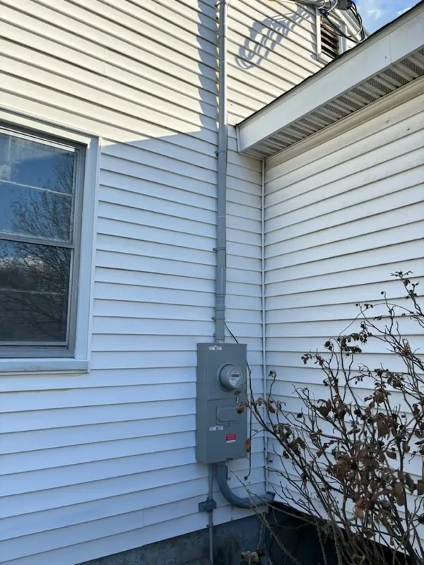 Electrical meter and service panel mounted outside a home